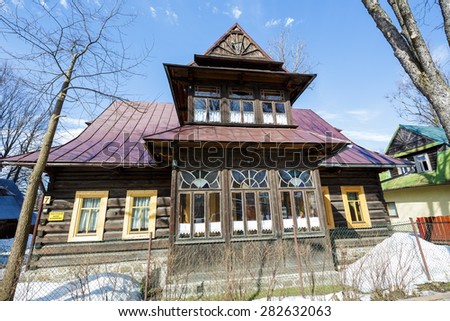 ZAKOPANE, POLAND - MARCH 10, 2015: Residential house, wooden villa built in  approx. 1897 in the style of the regional architecture, listed in the municipal register of architectural heritage