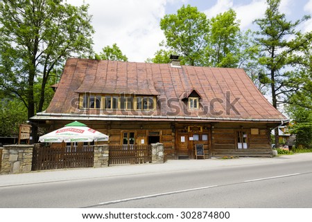 ZAKOPANE, POLAND - JUNE 11, 2015: Old wooden historic cottage made of wooden logs, built for Jozef Krzeptowski approx. 1850. Also known as Restaurant U Wnuka since 1907
