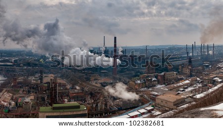 Panorama of the metallurgical factory with pipes and smoke, atmosphere pollution