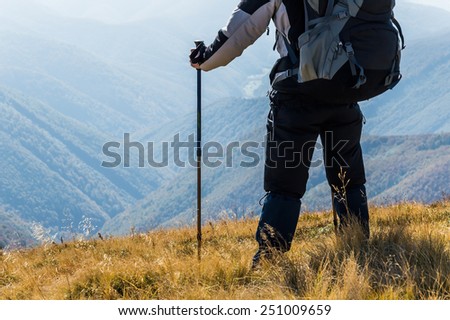 Traveler in the mountains looks away
