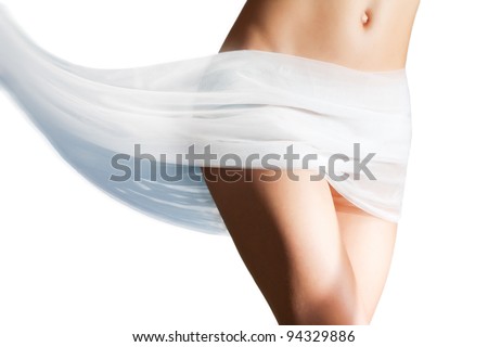 Beautiful woman with white tissue on her hips melting in red liquid