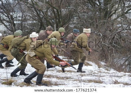 ROSTOV-ON-DON, RUSSIA - February, 16: Reenacts dressed as WW II soldiers fight on February, 16, 2014, in Rostov-on-Don, Russia. The battle they are reenacting was the Stalingrad Battle held.