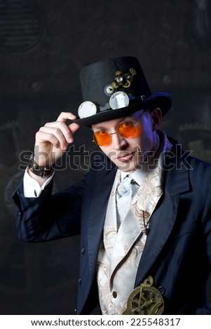Portrait of a steam punk man over grunge background
