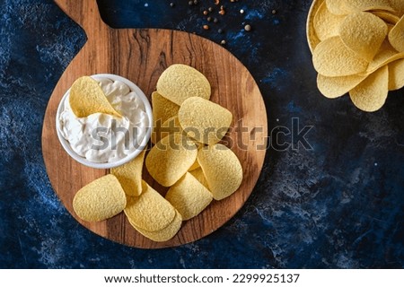 Similar – Image, Stock Photo Potato chips and sauce on the table, close up