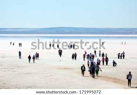 SALT LAKE, TURKEY - SEPTEMBER 22: People walking at Salt Lake on September 22, 2013 in Aksaray, Turkey. Salt Lake is the second largest lake in Turkey