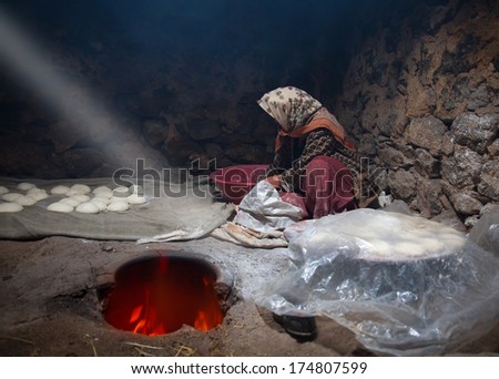 orient woman baking bread