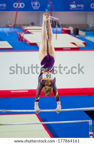 MERSIN, TURKEY - JUNE 21: Maria Trichopoulou, Greece performs exercise on uneven bars during International Tournament in Artistic Gymnastic Mediterranean games Mersin, Turkey on June 21, 2013