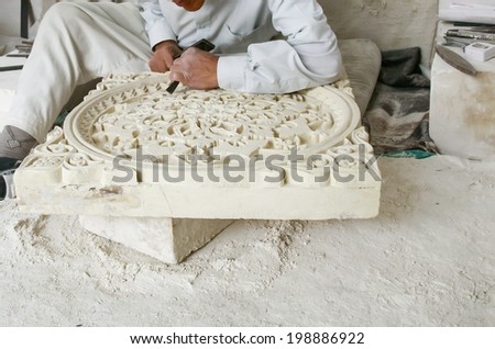 Stonemason. Hands detail of craftsman at work