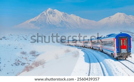 Similar – Foto Bild Ein schneeweisser ICE Zug mit einem dicken roten Streifen verlässt gerade München Hauptbahnhof. In seinen Fenstern spiegelt sich die Bahnhofshalle mit Neonleuchten, das graue Pflaster des Bahnsteigs zeigt einen weißen Streifen