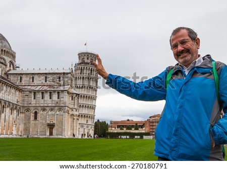 Man with Leaning Tower of Pisa, Italy