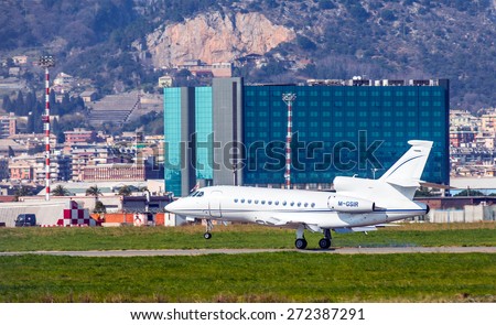 GENOA, ITALY - MARCH 18, 2015: Airplane takes off from Genoa Airport