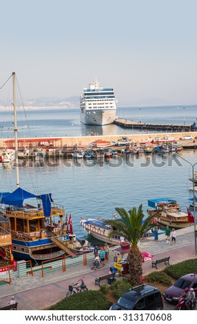 ALANYA, TURKEY - MAY 17, 2015: Beautiful white giant luxury cruise ship on stay at Alanya harbor