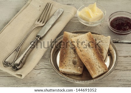 Breakfast with bread, butter and jam