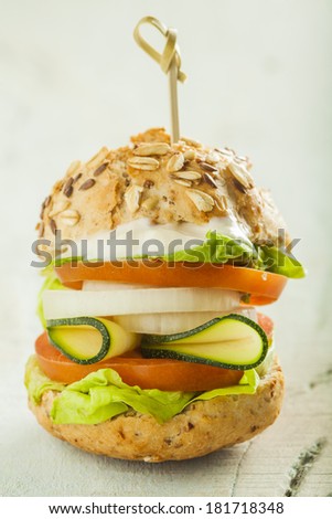 Delicious and tasty sandwich with tomato, lettuce, onion, ...
