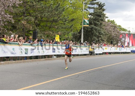 OTTAWA, CANADA Ã¢Â?Â? MAY 24, 2014: Colin Fewer wins the HTG Sports 5K event in the Tamarack Ottawa Race Weekend race with a time of 15:32.