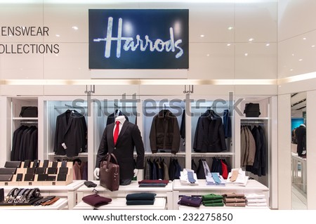 LONDON, ENGLAND OCTOBER 15, 2104: A retail outlet for Harrods. Harrods is the biggest department store in Europe  and occupies a 5-acre (20,000 m2) site in London.