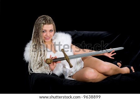 Sexy girl with sword  on  black background