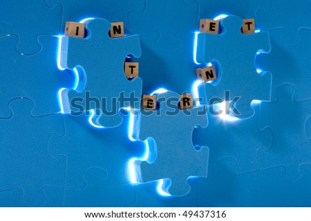 Blue puzzle with wood letter