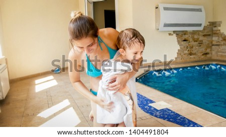 Image, Stock Photo Woman wiping calm big dog in bathroom after washing