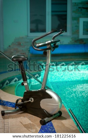 Photo of exercise bike standing at swimming pool