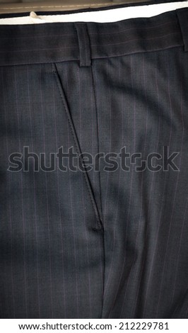 Closeup photo of pocket on male classic trousers