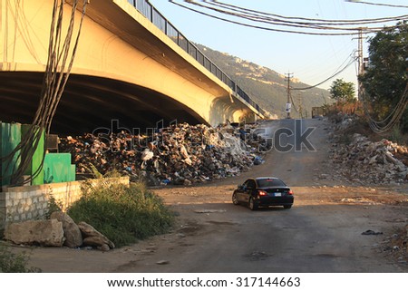 JOUNIEH, LEBANON - AUGUST 1: Piling trash in the streets of Lebanese cities shown on 1 August 2015 in the city of Jounieh. This garbage crisis is behind current demonstrations against the government.