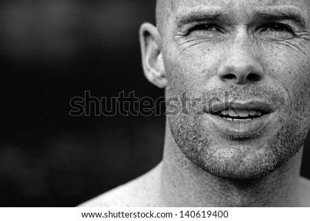 Intense black and white portrait of an athlete or sportive man