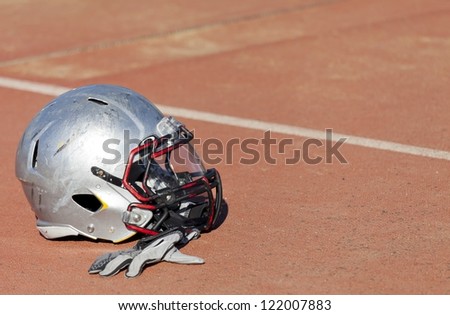 Football helmet on the floor of the stadium