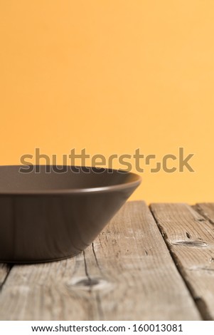 Empty bowl on old wooden table