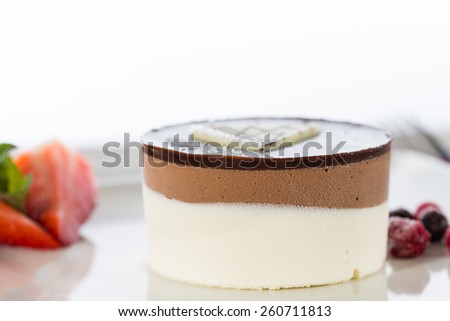 Delicious chocolate mousse with strawberries two flavors