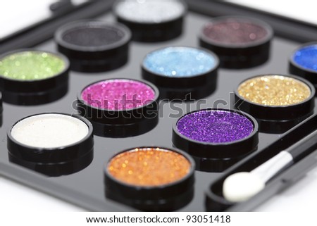 Set makeup with glitter paint composed of colors