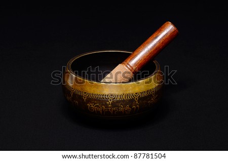 Tibetan singing bowl on dark background/Singing bowl/Tibetan bowl on dark background