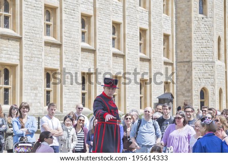 TOWER OF LONDON - MAY 15: Yeomen Warders of Her Majesty's Royal Palace and Fortress the Tower of London on May 15, 2014 in London. Beefeaters are ceremonial guardians of the Tower of London.