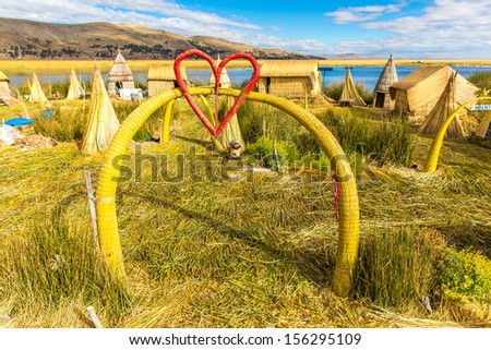 Floating  Islands on Lake Titicaca Puno, Peru, South America, thatched home. Dense root that plants Khili interweave form natural layer about one to two meters thick that support islands