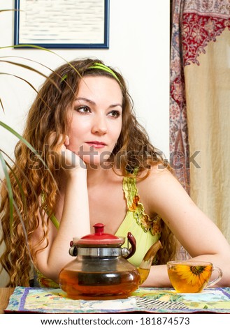 Portrait of young beautiful woman with tea The concept of eating and drinking