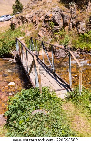 Bridge and Assy plateau in Tien-Shan mountain  in Almaty, Kazakhstan,Asia at summer. Nature of  green trees and lake