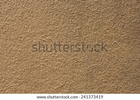 rough, less scattered cemented surface in light brown color. may be used as background or texture