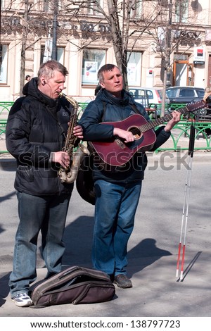 ST PETERSBURG, RUSSIA -APRIL 29 :  Blind musicians play on the street of St. Petersburg on April 29, 2011. In St. Petersburg on streets it is often possible to meet street musicians.
