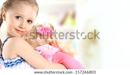 toddler girl with doll
