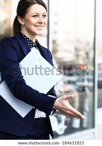 Business woman with arm extended for a handshake