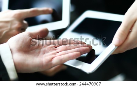 Modern business people doing business, being demonstrated on the screen of a touch-pad