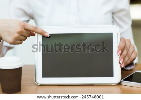 Digital tablet with blank screen in coffee shop cafe
