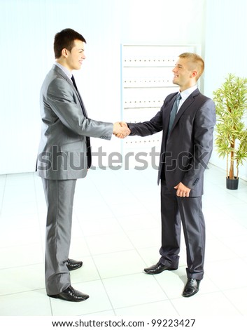 Business handshake and trust taken from above