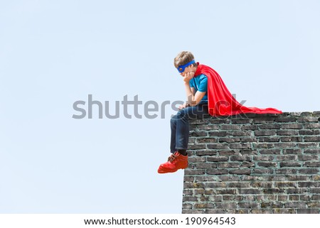 a boy acting like a super hero