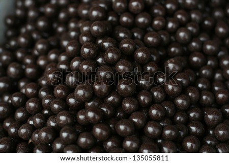 Chocolate covered nuts background