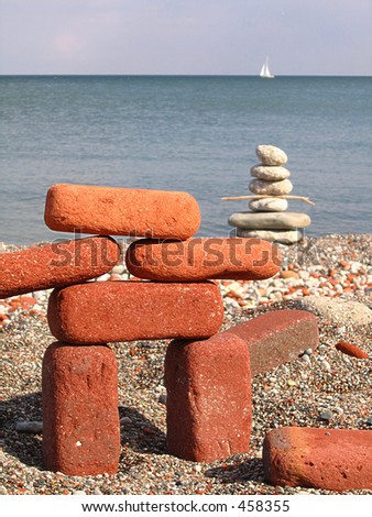 some people hanging around lakeshore can\'t resist to build an inukshuk