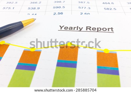 Financial paper charts and graphs.