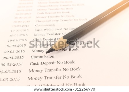 Close up document of bank statement with pencil on vintage tone : Can use for financial background.