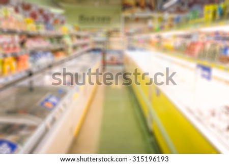 Blurred supermarket or warehouse for background.