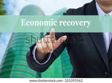 Businessman pointing to Economic recovery concept.